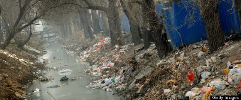 Trash clogs up a polluted canal at the edge of Beijing on March 16, 2012. China said that two-thirds of its cities currently fail to meet new air-quality standards introduced this week that are based on the pollutants most harmful to health. (MARK RALSTON/AFP/Getty Images) 