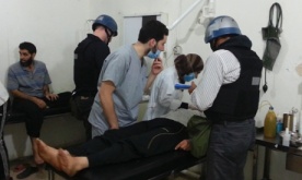 U.N. chemical weapons experts visit people affected by an apparent gas attack, at a hospital in the southwestern Damascus suburb of Mouadamiya. Photograph: Stringer/Reuters